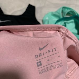 4 pack Nike sports bras; size M